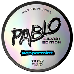 A round silver holographic nicotine pouch can labeled 'Pablo Silver Edition' in Peppermint flavor, with black and blue text on a white background.