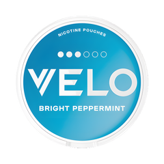 VELO nicotine pouch container with blue lid and white text on a white background