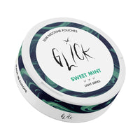 Front-angle tilted view of Glick Sweet Mint Slim Nicotine Pouches, Light Series. The can features a clean white design with green and blue marble accents around the edges. Highlighted in green text is the 'Sweet Mint' flavour, indicating a refreshing and mild mint profile. The can displays a 4mg nicotine strength with three light intensity markers, ideal for lighter nicotine users. The label includes 'Slim Nicotine Pouches,' the Glick logo, and 'Made in Europe,' making it a premium choice available in Austr