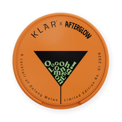 Round orange label with 'Klar x Afterglow' branding and cocktail text on a white background