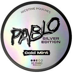 A round silver holographic tin of Pablo Silver Edition Cold Mint nicotine pouches, featuring a black logo and text on a white background.