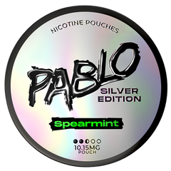 A round silver holographic nicotine pouch can labeled 'PABLO SILVER EDITION' and 'Spearmint' on a plain white background.