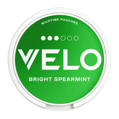 Green container of Velo nicotine pouches with 'Bright Spearmint' flavor on a white background