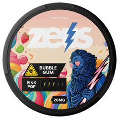 A round black-lidded nicotine pod container for Zeus Nicoderm Zero, featuring a colorful label with the text 'BUBBLE GUM', 'PINK POP', and '20MG'. The label includes the brand name 'NICOPODS' at the top, a yellow warning icon, and an illustration of a blue lion-like figure holding a pink lightning bolt.