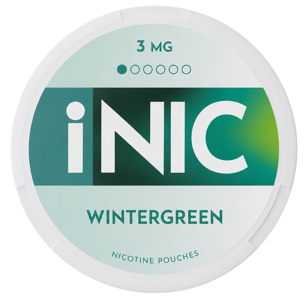 A round white plastic container of iNIC Wintergreen nicotine pouches, 3 mg strength, featuring a mint green and teal label with bold white branding.